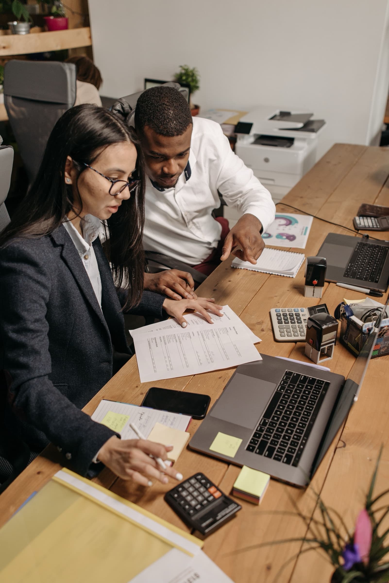 Accountants working through tax season while an AI receptionist books client appointments